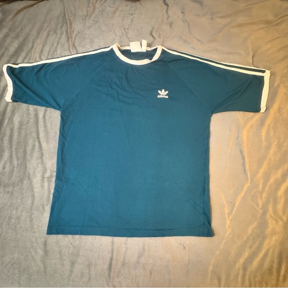 Adidas Blue Short Sleeve Tee with Iconic Design
#1040